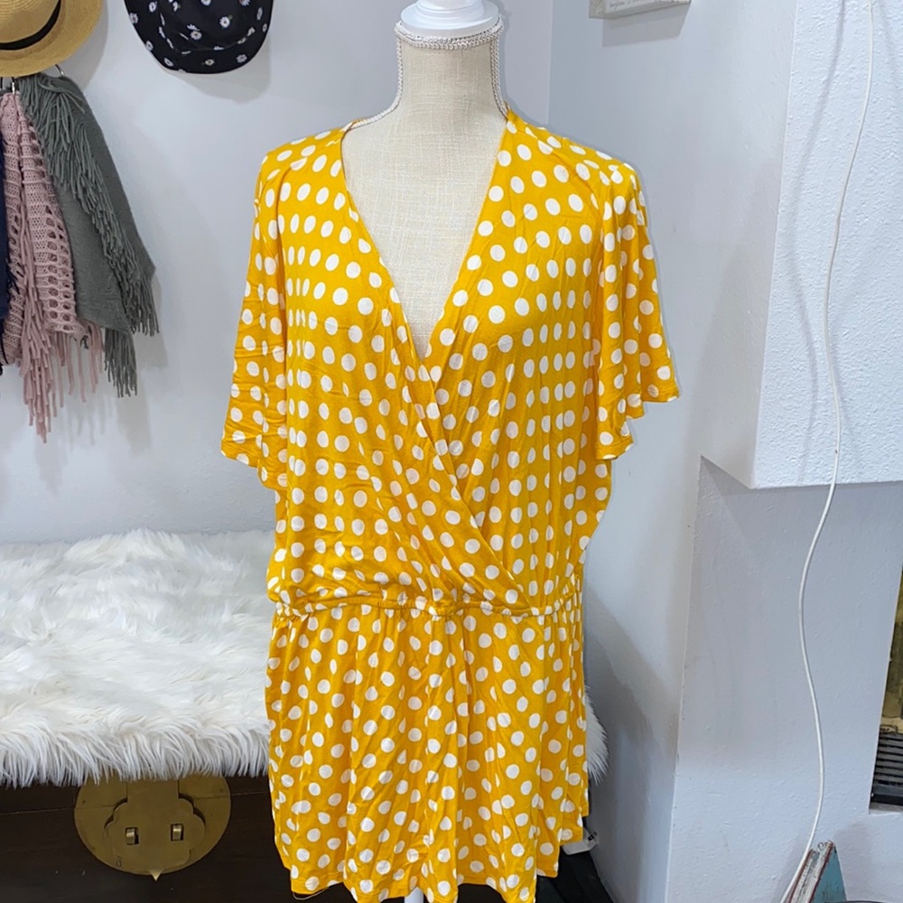 Yellow blouse with white polka dots